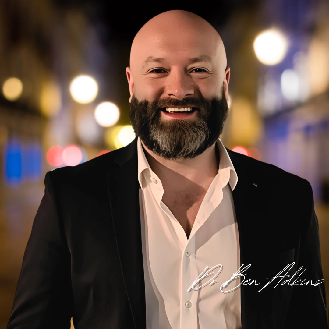 Dr. Ben Adkins, smiling, with his signature